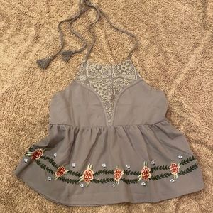 Embroidered backless tie top.